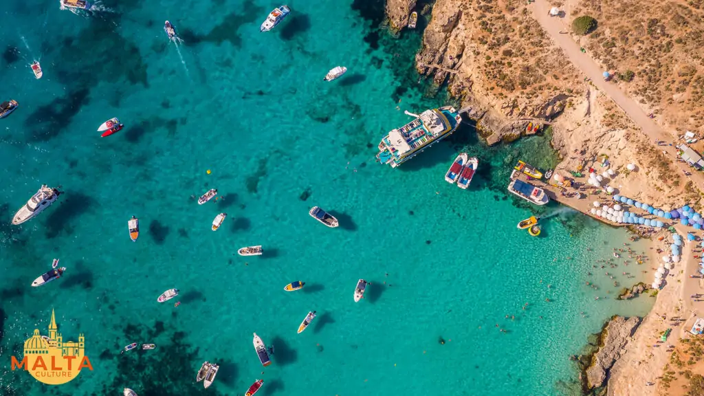 The gorgeous Blue Lagoon in Comino, as seen from above on a mid-summer's day.