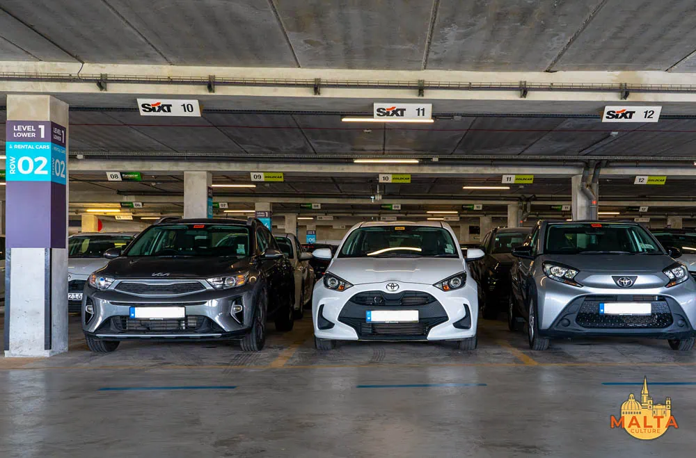 Car rental vehicles from different companies parked on Lower Level 1 at Park East car park, Malta Airport. 