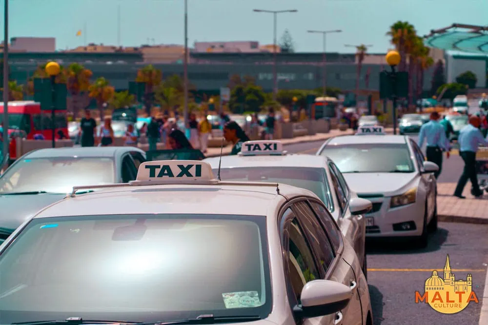 Malta airport transfer taxis waiting outside Arrivals.