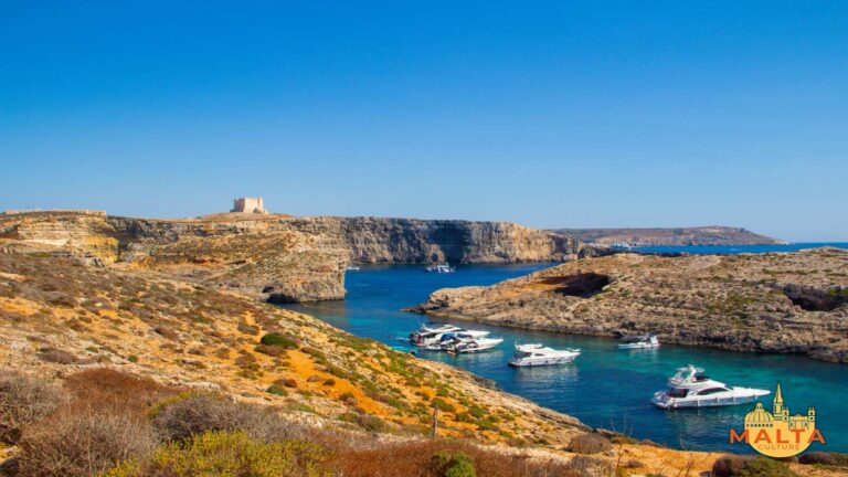 Scenic views of the Crystal Lagoon, Caves anad Santa Marija Tower in Comino.
