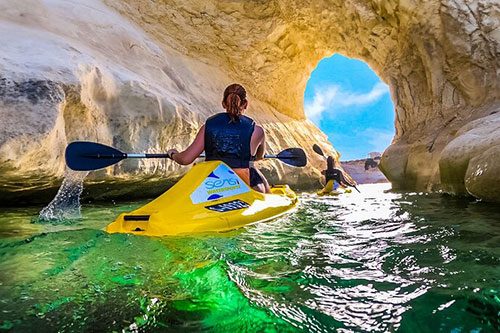 Exploring Gozo's seaside by kayak is a popular outdoor activity for visitors.